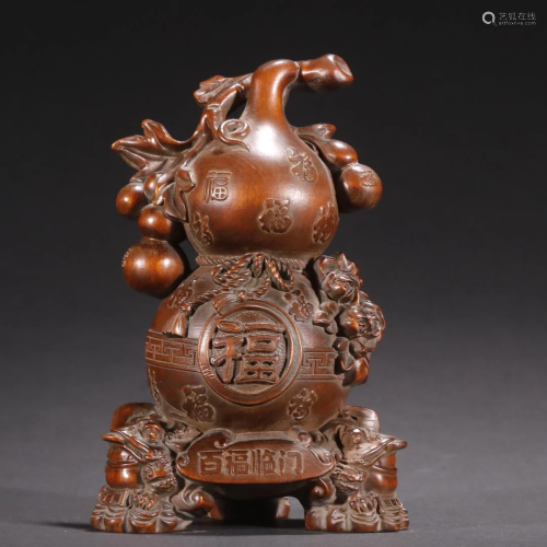 A Finely Carved Huangyang Wood Gourd Ornament