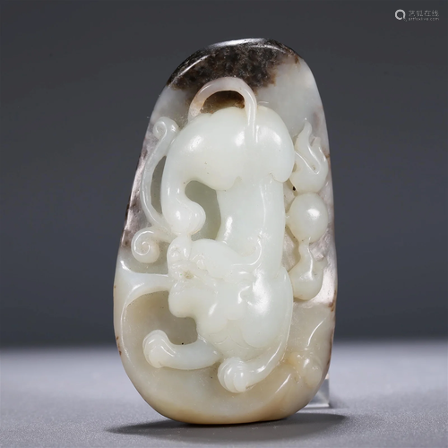 A Superb White Jade 'Auspicious Beast' Pendant