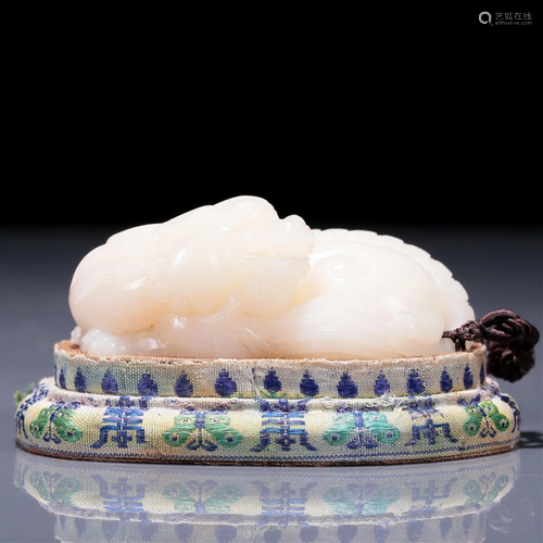 An Exquisite White Jade 'Lion' Pendant