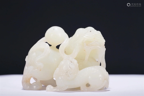 A Wonderful Gaogu White Jade 'Lion' Group