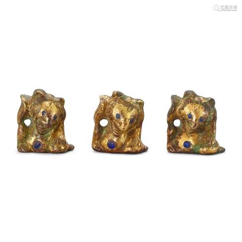 A set of three glass-inlaid gilt-bronze 'bear' supports, Han...