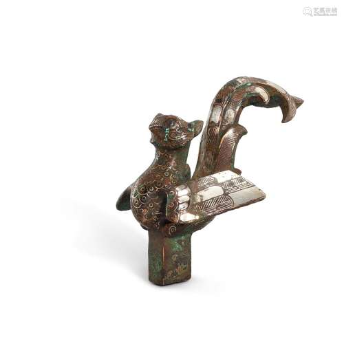 A silver-inlaid bronze 'bird' staff finial, Eastern Zhou dyn...