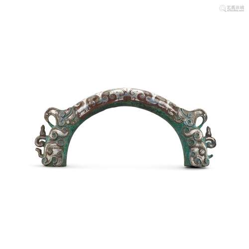 A large silver-inlaid bronze chariot fitting, Eastern Zhou d...