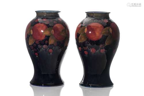 PAIR OF MOORCROFT POTTERY POMEGRANATE VASES