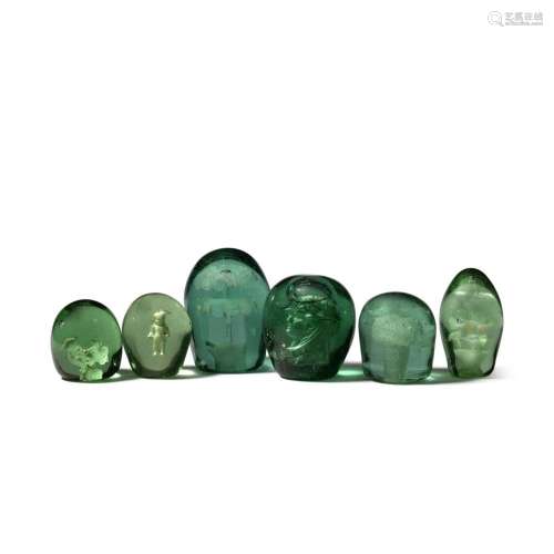 A COLLECTION OF SIX GREEN INTERNALLY DECORATED DUMP GLASS PA...