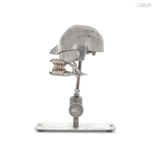 AN ALUMINUM DENTIST'S MODEL OF A MOUTH AND HEAD height 1...