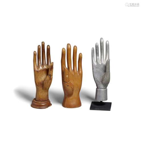 A GROUP OF THREE HAND MODELS early 20th century, two made of...