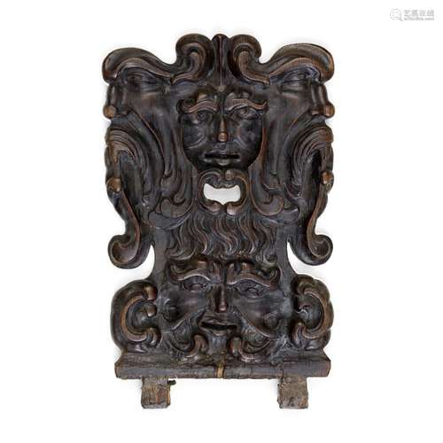 A CONTINENTAL CARVED OAK PANEL OF FOUR FACES height 19 1/2in...