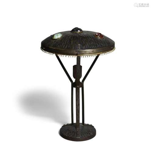 AN AUSTRIAN PATINATED METAL AND CHUNK GLASS TABLE LAMP early...