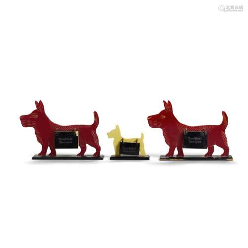 THREE FIGURAL BAKELITE RECIPE STANDS comprising a small yell...