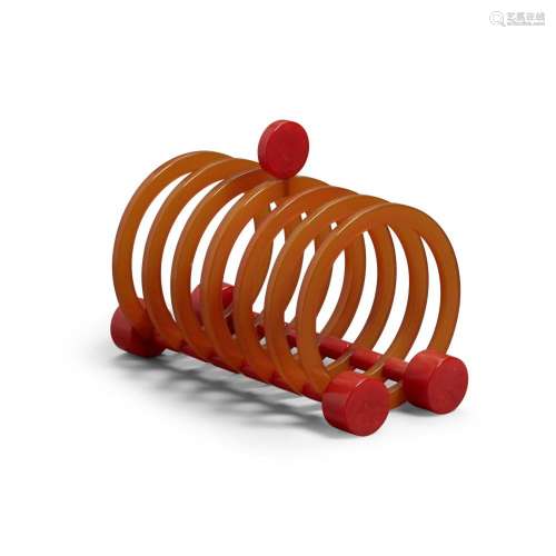 A BAKELITE TOAST RACK IN MARBLEIZED RED AND TRANSLUCENT ORAN...