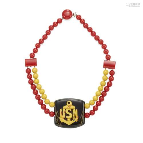 A BAKELITE 'USN' NECKLACE IN YELLOW, RED AND BLACK l...