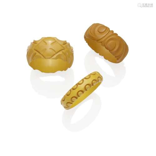 THREE CARVED BAKELITE BRACELETS IN CREAM OR BUTTERSCOTCH dia...