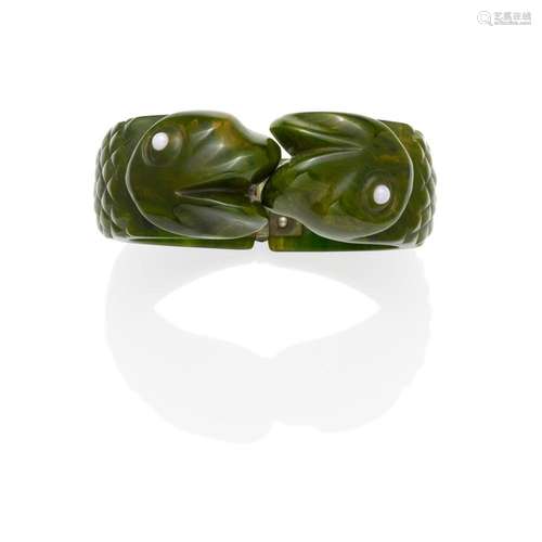 A BAKELITE 'SERPENT' HINGED BRACELET IN GREEN diamet...