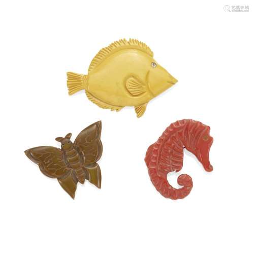 THREE BAKELITE ANIMAL BROOCHES comprising a red seahorse, a ...