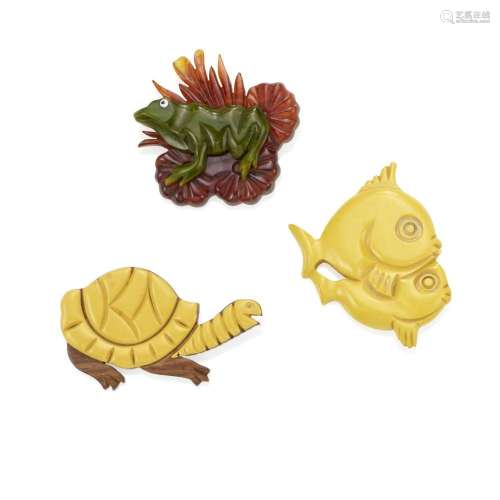 THREE BAKELITE ANIMAL BROOCHES comprising a yellow pair of f...