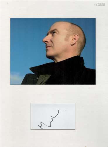 Midge Ure autograph mounted display. Mounted with a photogra...