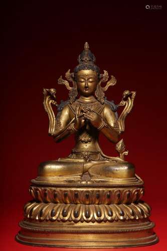 A gilt bronze statue of Avalokitesvara holding a lotus