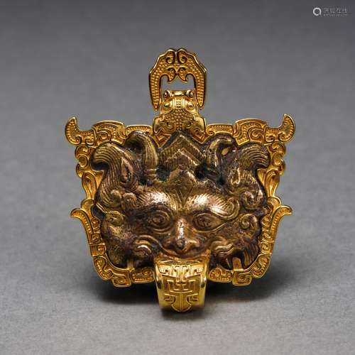 A Gold Mounted Bronze Pendant