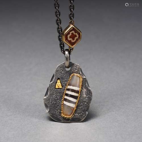 A Dzi Bead Pendant