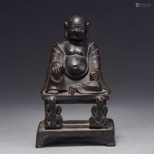 A Bronze Seated Figure