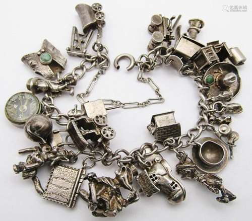 VINTAGE STERLING CHARM BRACELET LOADED WITH