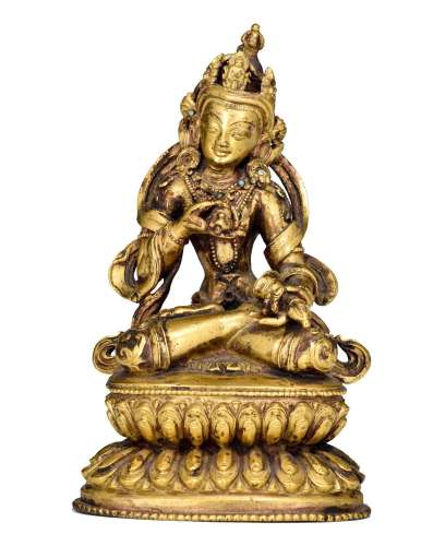 A Sino-Tibetan gilt-bronze figure of Vajrasattva, with semi-...