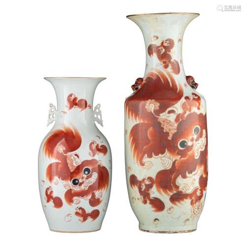 Two Chinese iron-red 'Buddhist lions' vases, both with a sig...