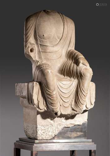 A Chinese grey limestone figure of a seated Buddha, partiall...
