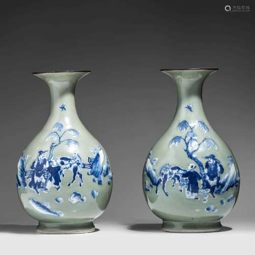 A fine pair of Chinese blue and white on celadon ground pear...