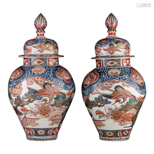 A similar pair of large Japanse Imari 'Crane' vases and cove...