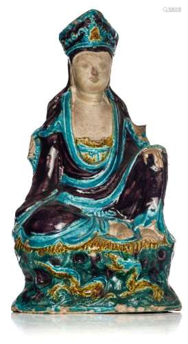 A Chinese Fahua-style glazed figure of a seated Guanyin, lat...
