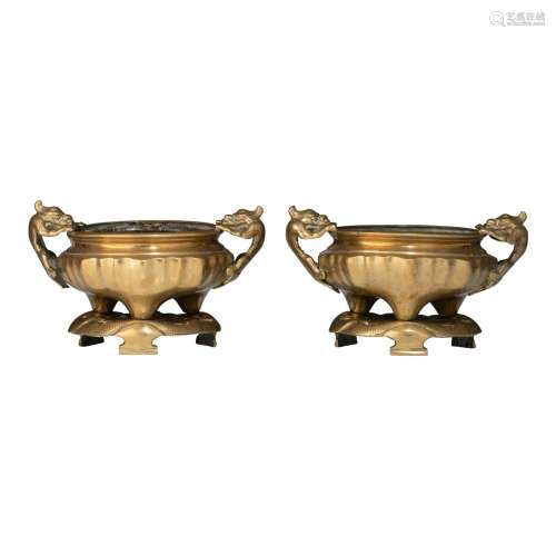 Two Chinese gilt bronze censers on a lotus-leaf stand, 20thC...