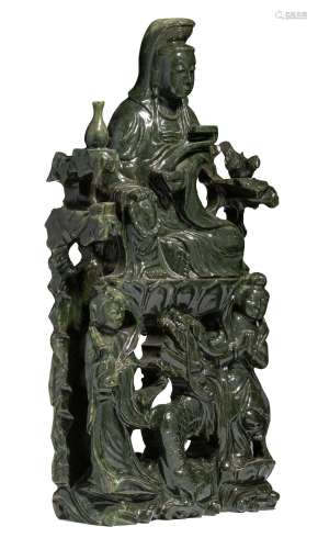 A Chinese green jade carving of a seated Guanyin, H 75 - W 3...