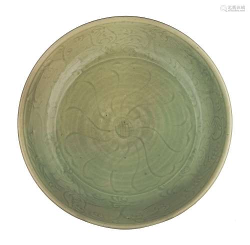 A large Chinese carved Longquan celadon 'Peony' charger, ø 4...