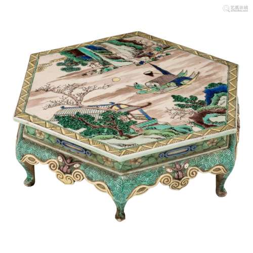 A Chinese famille verte hexagonal stand, raised on dragon fe...