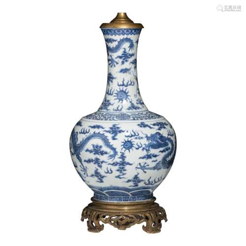 A Chinese blue and white 'Dragons' bottle vase and bronze mo...