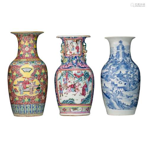 A Chinese blue and white vase and two famille rose vases, 19...