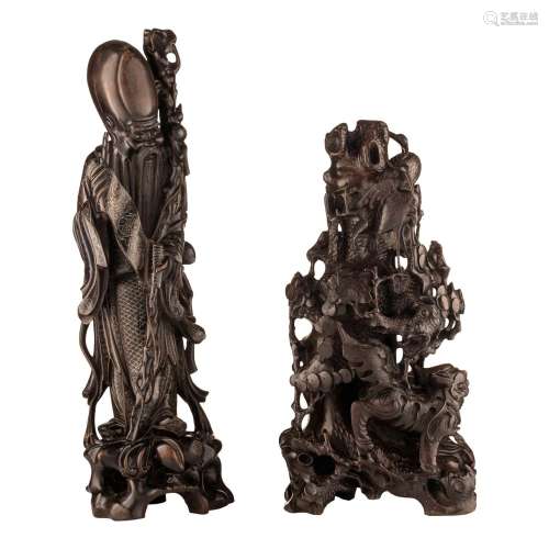 Two Japanese hardwood carvings of Shou Lou and an animated g...