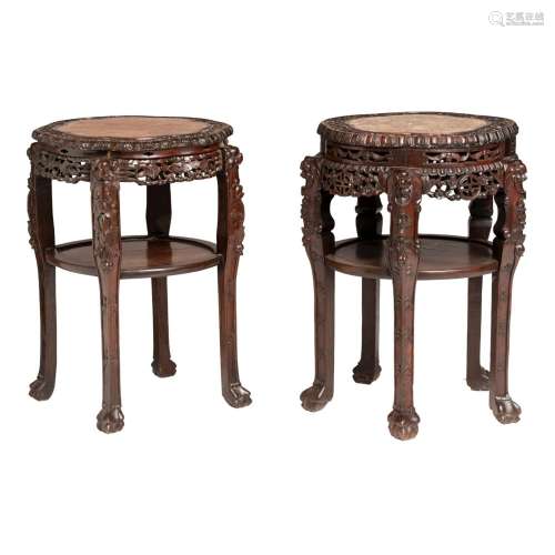 A pair of Chinese carved rosewood stands, with marble plaque...