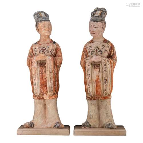 A series of two large Chinese painted pottery figures of off...