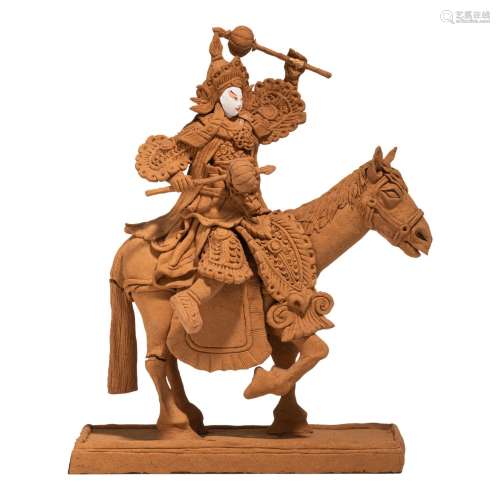 A decorative biscuit figure of a Chinese warrior on horsebac...