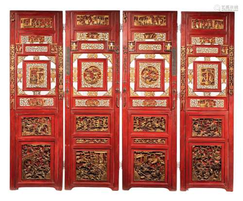 A South-Chinese four-fold gilt and red lacquered wood screen...