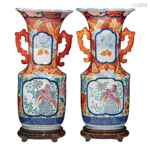 A pair of Japanese Imari vases, paired with stylised dragon ...