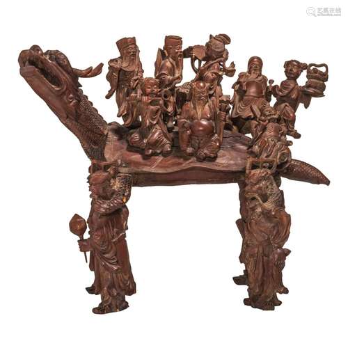 A Chinese hardwood carving of 'Immortals on a Gui dragon', H...