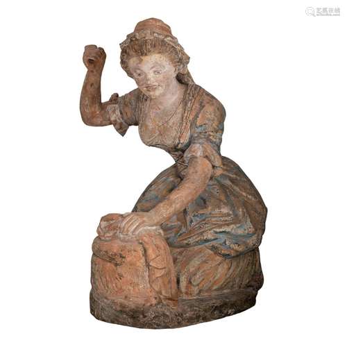 A very large polychrome terracotta sculpture of a woman dryi...