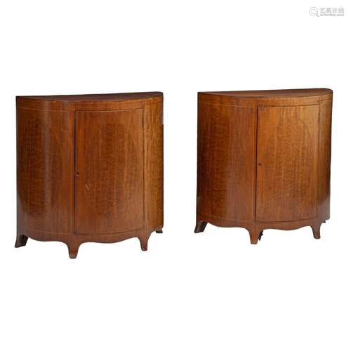 A pair of English Regency mahogany veneered demilune cabinet...