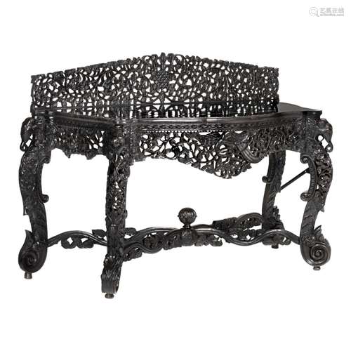 An Anglo-Indian very richly carved exotic hardwood console t...