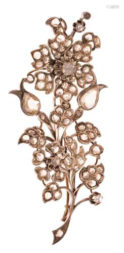 A floral-shaped silver and gold brooch, set with rose cut di...