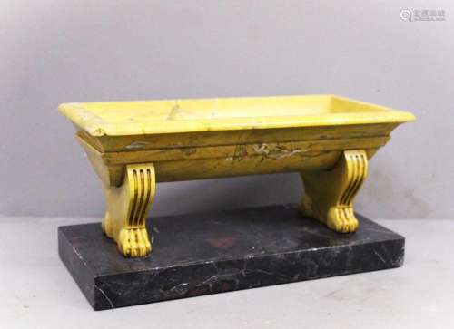 Small marble bath. in antique yellow marble.